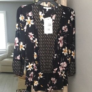 Black floral blouse. Nicely fitted to body